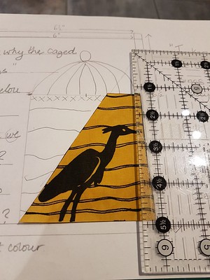 Bird appique tried against paper design